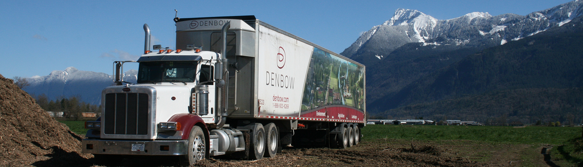 Denbow Transport Truck with snow-covered Mt. Cheam in background