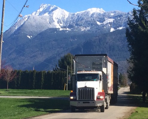 Denbow Transport Truck with snow-covered Mt. Cheam in background