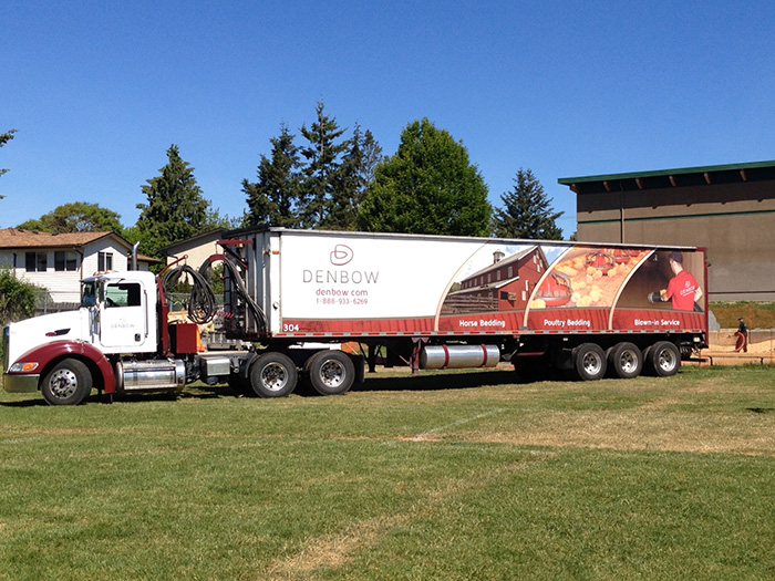 Denbow blower truck installing playground wood chips in Victoria