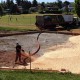 Denbow blower truck installing playground wood chips in Victoria